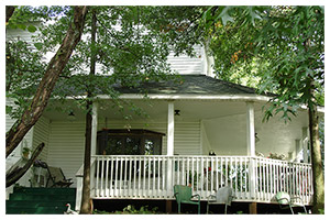 Farmhouse porch looking out over the grounds